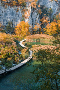 Wooden s-shaped path in plitvice lakes national park in croatia in autumn