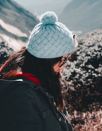 Rear view of woman in hat during winter