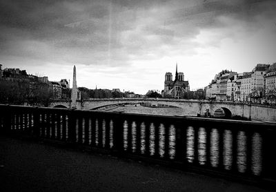 View of buildings against cloudy sky