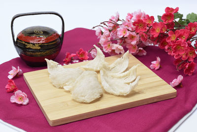 Close-up of pink roses on table