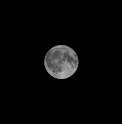 Low angle view of moon against sky at night