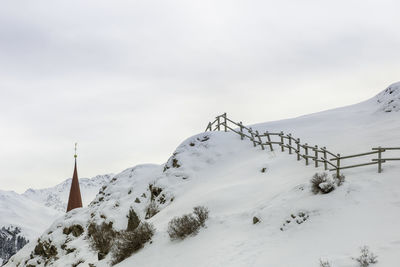 Scenic view of snow covered mountain against sky