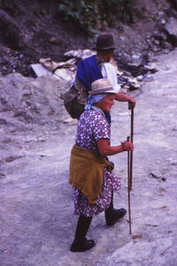 Rear view of man and woman walking