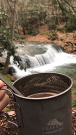 Person holding coffee cup