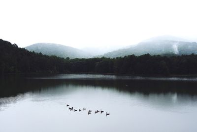 Scenic view of lake with mountains in background