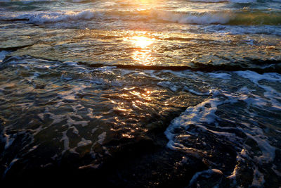 Close-up of rippled water in sea against sky