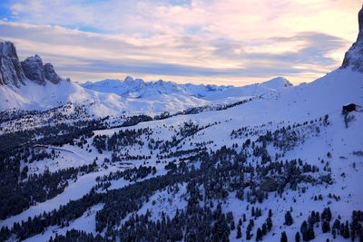 Scenic view of snowcapped mountains against sky during sunset