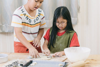 Mother and girl preparing food