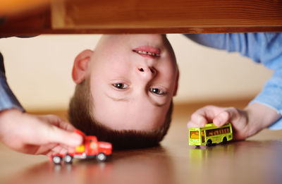 Portrait of boy playing with toy blocks