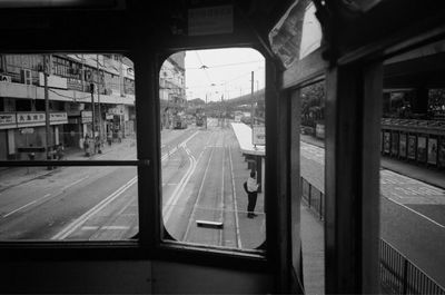 View of railroad station platform through window