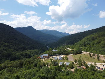 High angle view of buildings and mountains against sky