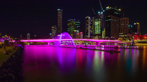 Illuminated city buildings at night