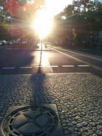 Close-up of street during sunset