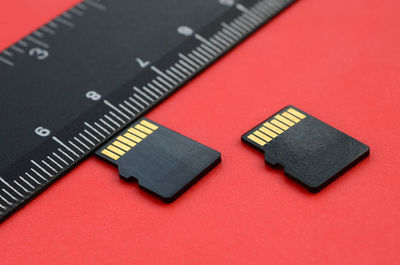 High angle view of memory card against red background