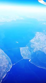 Aerial view of sea and island against sky