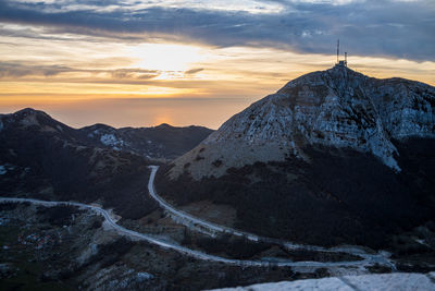 Scenic view of snowcapped mountains against sky during sunset