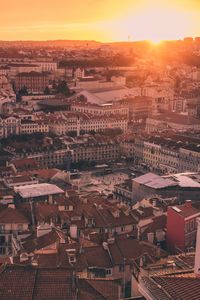 Aerial view of cityscape against sky during sunset