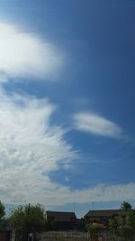 High section of built structure against cloudy sky