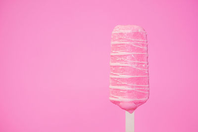 Close-up of ice cream against pink background