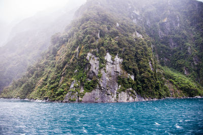 Scenic view of sea against mountain