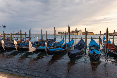 Boats moored at harbor