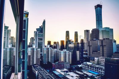 Modern buildings in city against sky