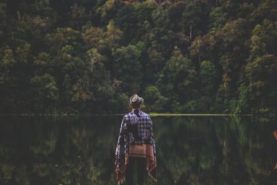 Rear view of a man in water