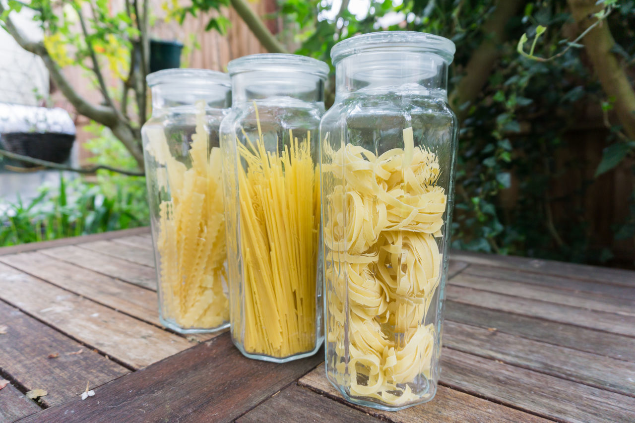 CLOSE-UP OF BANANAS IN JAR