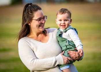 Portrait of happy mother and daughter outdoors