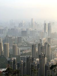 High angle view of modern buildings in city against sky