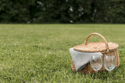 Close-up of wicker basket on field