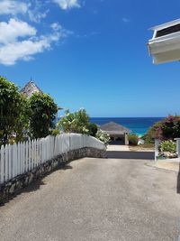 Scenic view of beach against blue sky