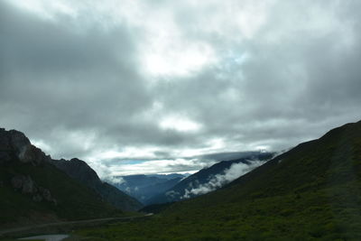 View of mountain range against cloudy sky