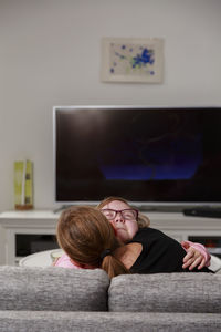 Mother and daughter hugging