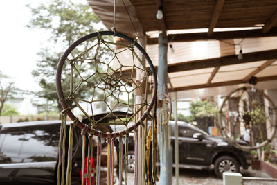 Close-up of bicycle hanging on tree