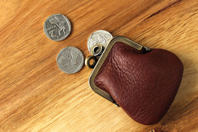 High angle view of coins on table