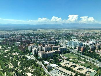 High angle view of city buildings against sky