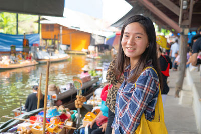 Portrait of smiling woman at market