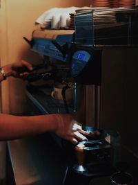 Midsection of woman holding coffee cup