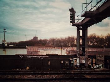 Bridge over city against sky
