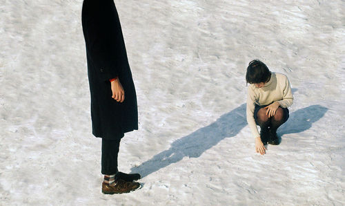 Woman standing in snow