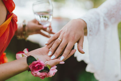 Cropped image of people holding hands