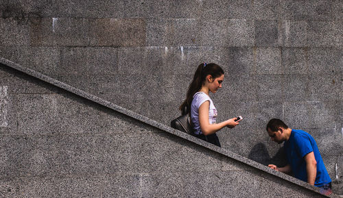 High angle view of friends on wall
