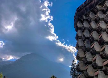 Low angle view of building against cloudy sky