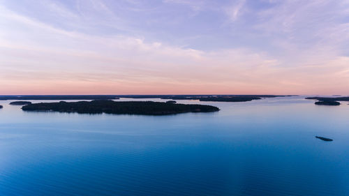 Scenic view of sea against sky at sunset