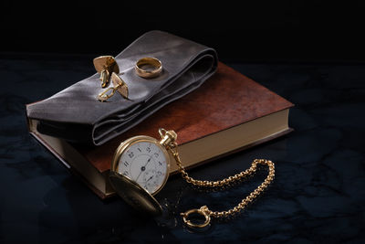 High angle view of clock on table