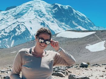 Portrait of woman sitting on mountain