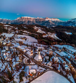 High angle view of snow covered mountains against sky