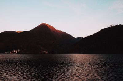 Scenic view of silhouette mountains against clear sky