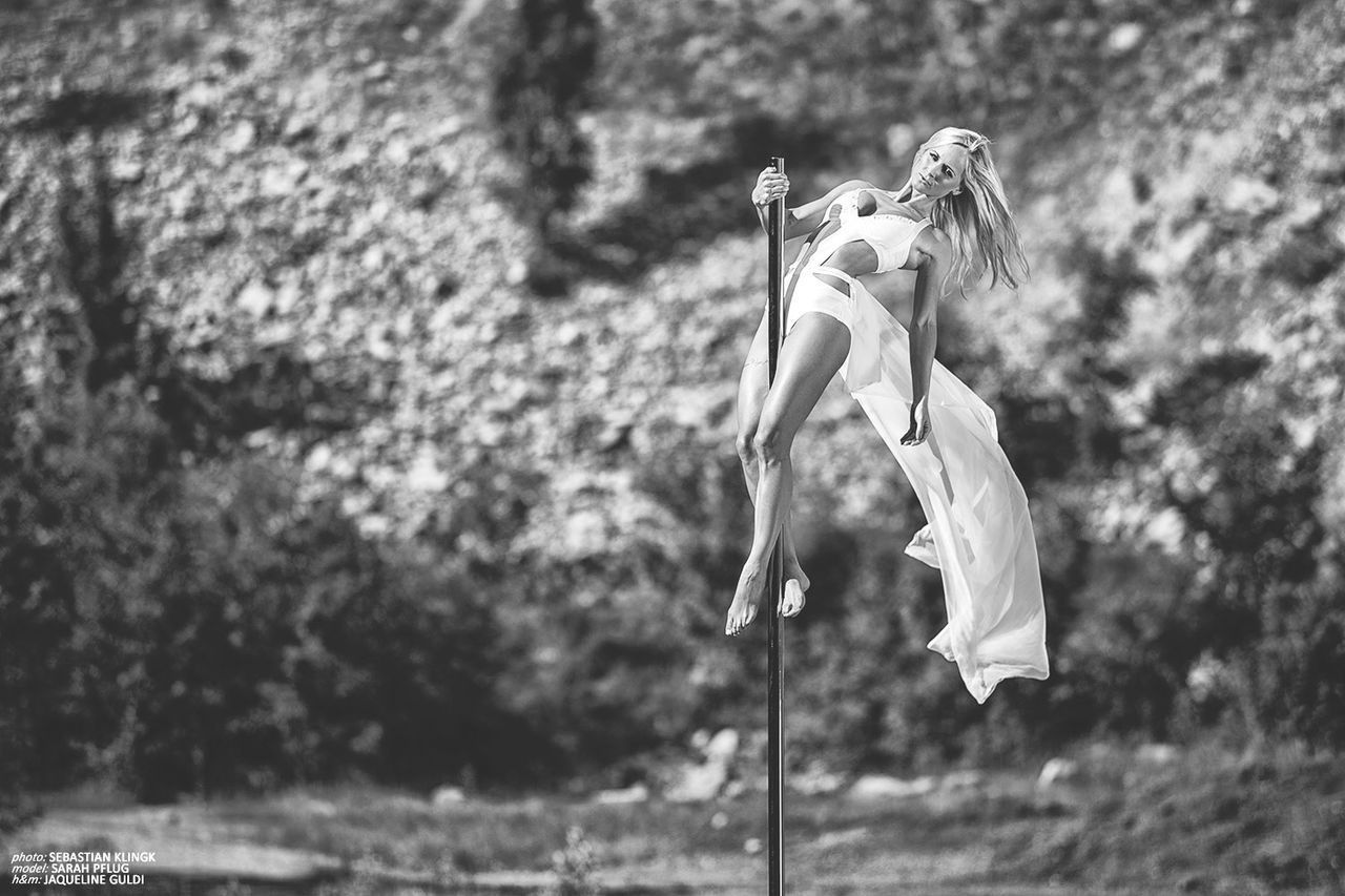 focus on foreground, close-up, selective focus, hanging, flower, day, outdoors, nature, pole, rope, sunlight, no people, tree, growth, stem, tied up, plant, flag, fragility, white color